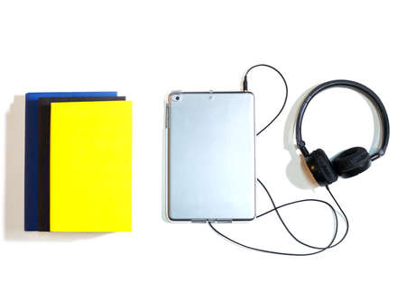 Books and headphone isolated over white background.View from top.の写真素材