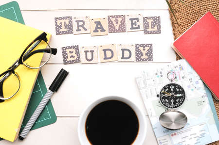 Travel Tips concept.A compass ,book, passport and coffee cup on white desk written wioth text "Travel Tips"の写真素材