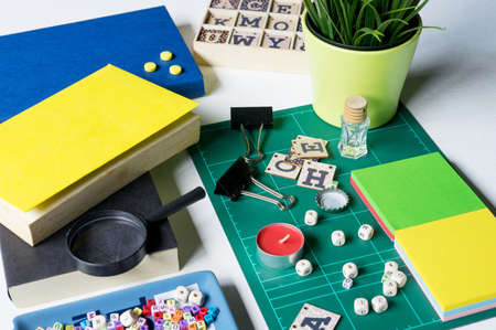 Notebook, magnifying glass and few other stationery objects on white table.View from top.Education concept.の写真素材