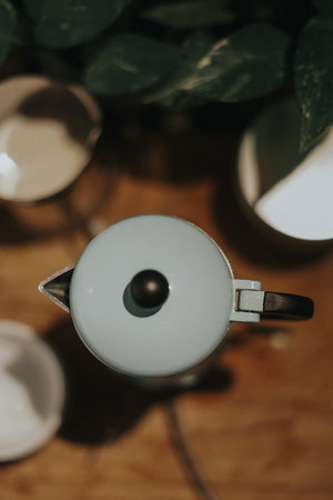 Top view of a mocca pot on the stove.Vintage filter and artificial grain effects applied.の写真素材
