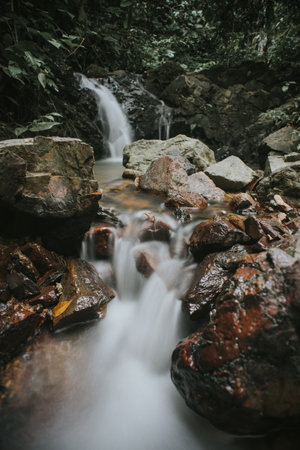 Rainforest waterfall in slow shutter mode.の写真素材