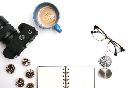 Notebook,spectacle,pinecones,computer keyboard and mouse on white office table.Top with copy space.Flat Lay concept.の写真素材