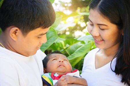 Parents and children are happy in the morning.の写真素材