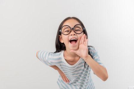 happy little girl, isolated on whiteの写真素材