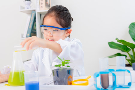 happy Asia little girl with flasks for chemistry science isolated on a white background