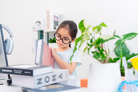 Asia A little Kid studying with video online lesson at home.の写真素材