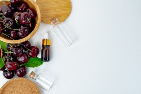 Background Fresh fruit red sweet cherrys isolated in a wooden cup on white backgroundの写真素材
