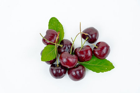 Background Fresh fruit red sweet cherrys isolated on white backgroundの写真素材
