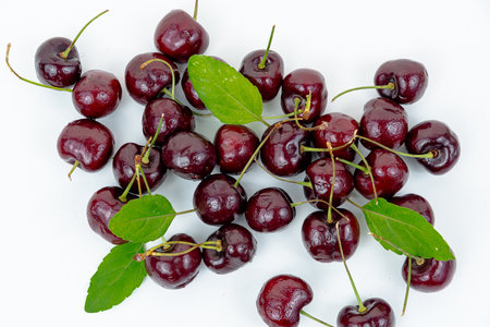 Background Fresh fruit red sweet cherrys isolated on white backgroundの写真素材