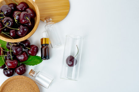 Background Fresh fruit red sweet cherrys isolated in a wooden cup on white backgroundの写真素材