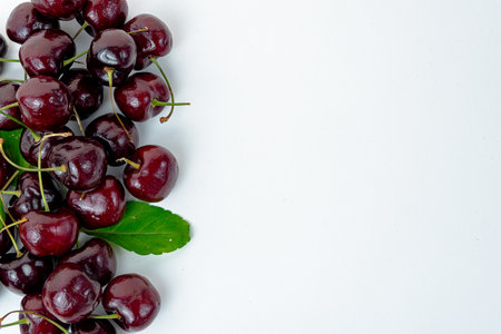 Background Fresh fruit red sweet cherrys isolated on white backgroundの写真素材
