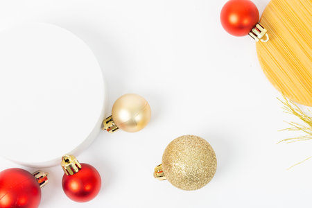A white background with a red and gold ornament on it. The ornament is surrounded by other red and gold ornamentsの写真素材