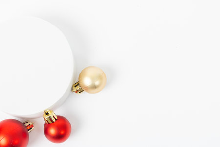 A white background with a red and gold ornament on it. The ornament is surrounded by other red and gold ornamentsの写真素材