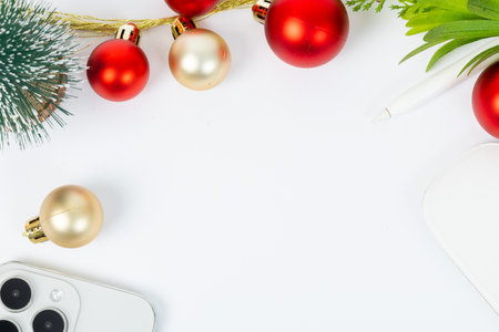 A white background with a Christmas tree and a pen. The pen is on the right side of the imageの写真素材