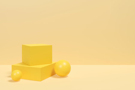 A yellow box with three yellow balls on top of it is placed on a yellow background. The box and balls create a playful and fun atmosphereの写真素材