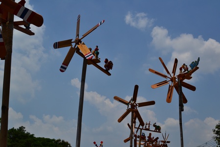 Toy wind turbine and blue sky.の写真素材