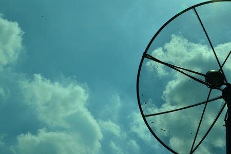Satellite dish and blue skyの写真素材