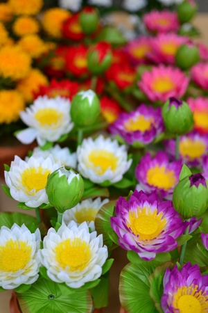 background of colorful artificial flowers の写真素材