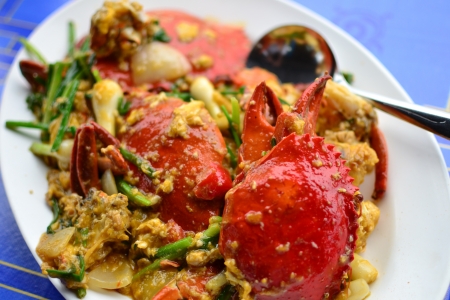 Fried crab with curry powder  on white plate.の写真素材