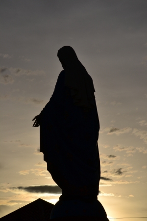 Silhouette  Virgin mary statue in thailand.の写真素材