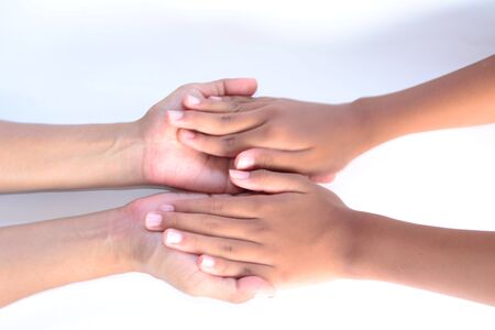 Hand in hand on white background