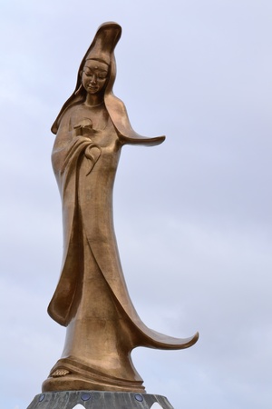 Guan Yim statue in front of city, macau,Asiaの写真素材