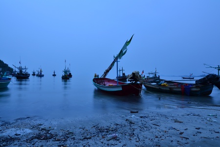 Wooden fishing boats are  landing near the beach,Thailand.の写真素材