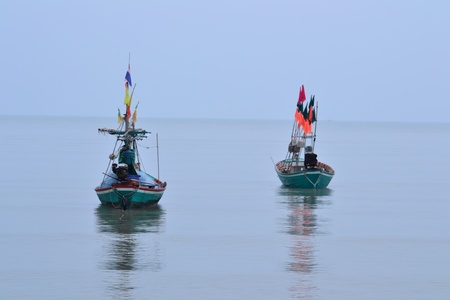 Wooden fishing boats are  landing near the beach,Thailand.の写真素材
