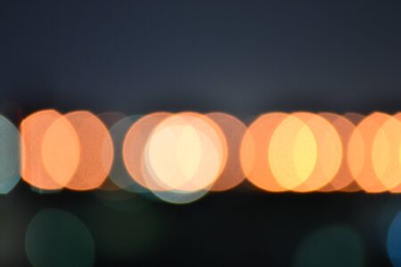Abstract circular bokeh background of Light on the road.の写真素材