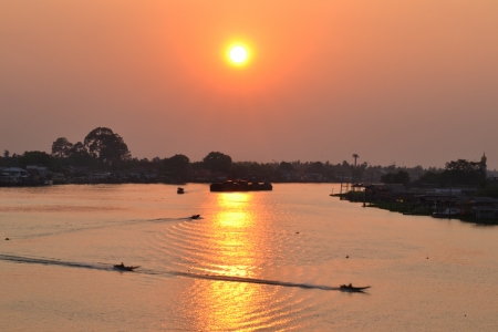 Boat and Sunse at  the Chaopraya River, Bangkok, Thailand .の写真素材