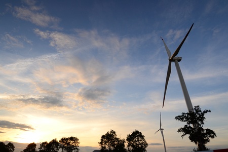 Electric wind turbine generators on blue sky,Thailand.