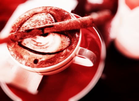 Cup of coffee with artistic cream decorationの写真素材