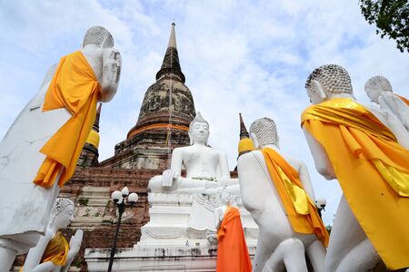 Old buddha statue and ancient Pagoda at ayutthaya Province, Thailand.の写真素材