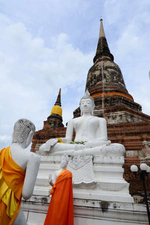 Old buddha statue and ancient Pagoda at ayutthaya Province, Thailand.の写真素材
