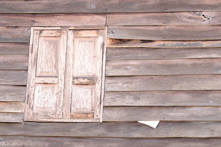 Old wooden textured wall and window  from Thailand.の写真素材