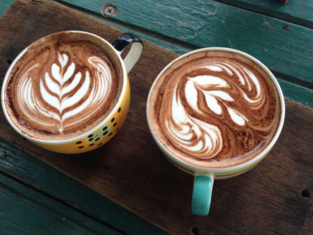 Hot coffee on the wooden desk.