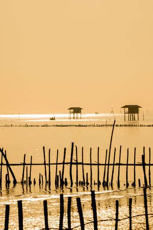 silhouette Fisher man hut build in the ocean Bang Tabun Thailandの写真素材