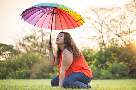 Portrait fashion Beautiful fat woman in gardenの写真素材