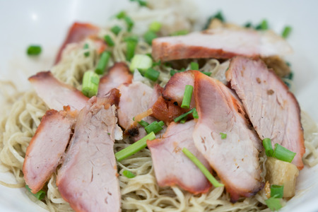 chinese noodle with red roast pork, crispyの写真素材