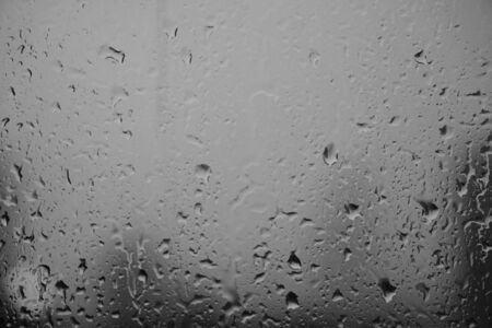Rain drop in the window black and whiteの写真素材