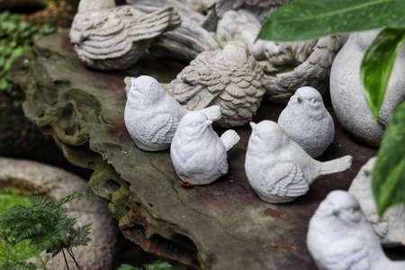 Vintage garden statues in tropical gardenの写真素材