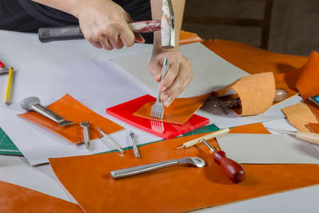 Leather craft maker in workhop