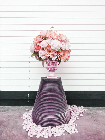 Bouquet of pink and white flowers close up on clear wood background, elegant vintage floral decor, Eye level angle viewの写真素材