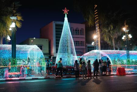 Trang,Thailand - December 26, 2018 : People enjoy visited at christmas building and new year's eve festival in traffic island near the clock towerのeditorial素材
