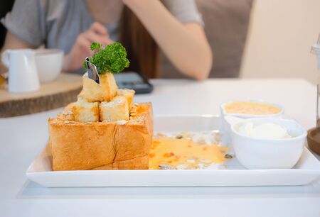 Delicious honey toast with topping and sauce. Dessert meal of gourmetの写真素材