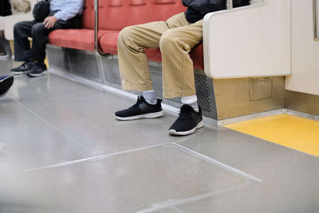 Social distancing between seat on subway train and people go to work and travel concept