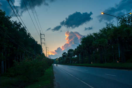 Sunset sky with motorcycles on trang-palian road