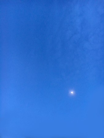 looking up on the sky at the evening of someday, the moon shine to earthの写真素材