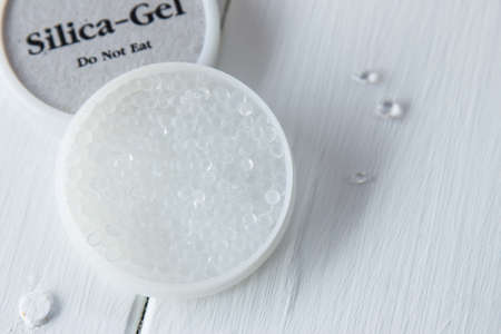 Silica gel box on white wooden table