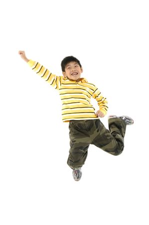 Adorable child jumping a over white background
